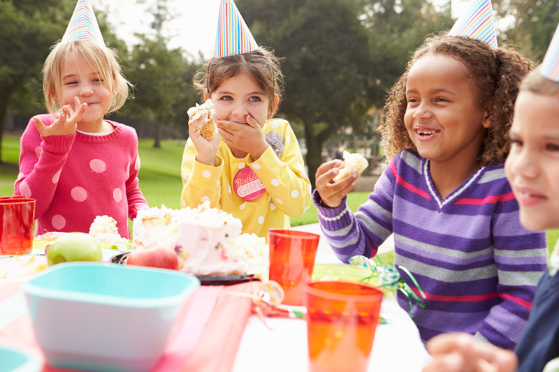 Group Of Children Having Outdoor Birthday Party